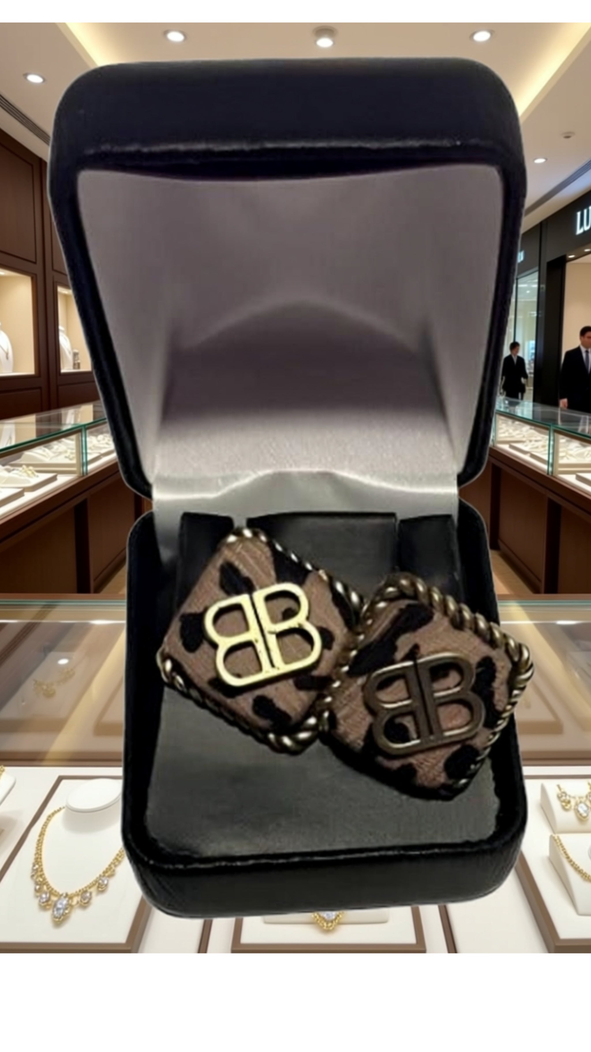 Luxury earrings for women displayed in a black jewelry box against a stylish background.